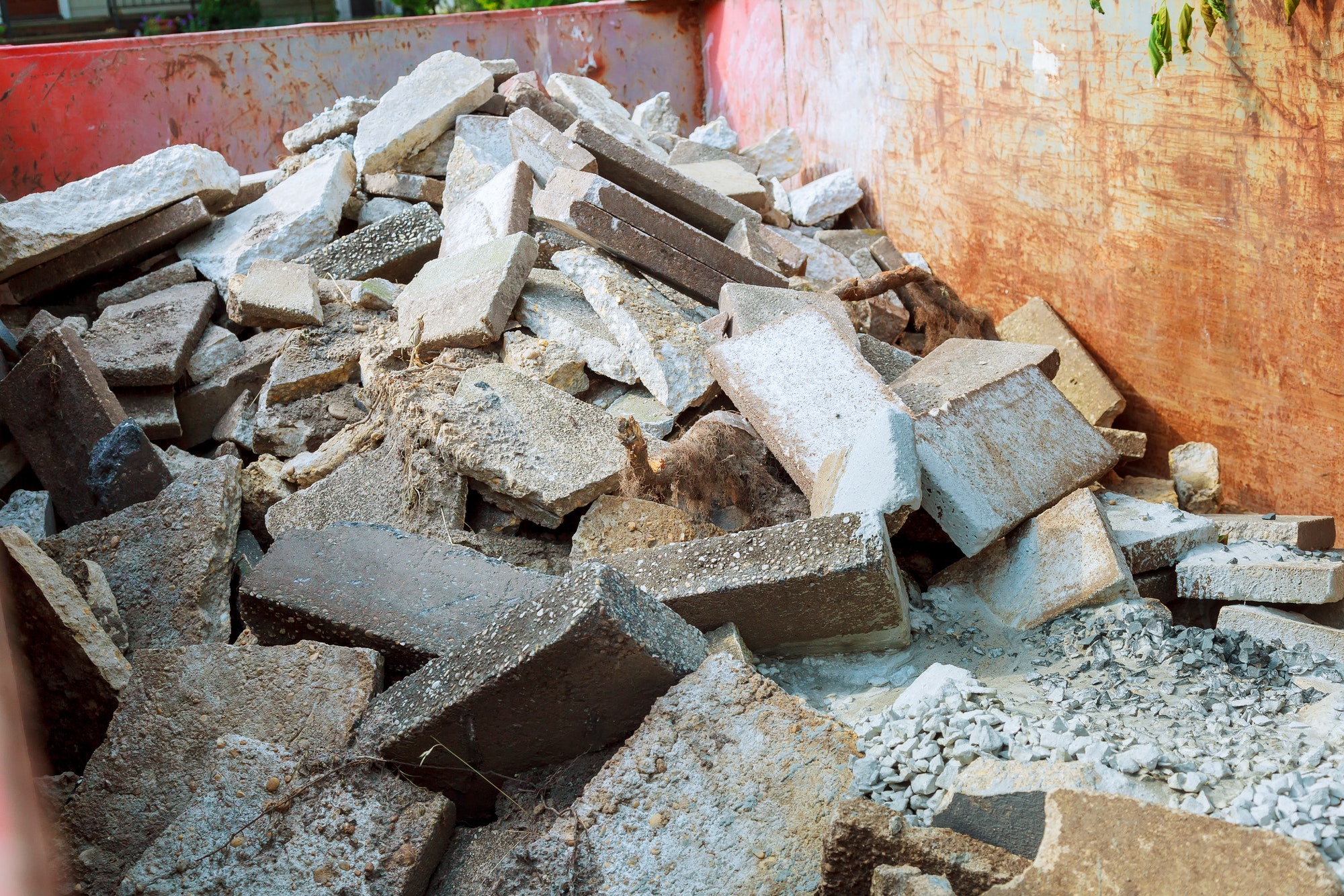 Loaded dumpster near a construction site, home renovation